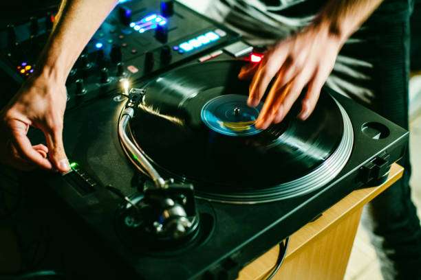 The vinyl record player is playing music.